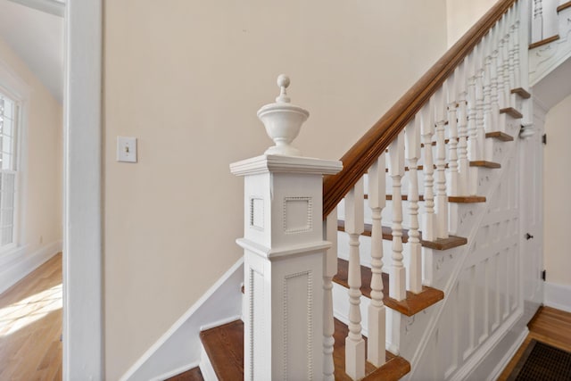 stairs featuring wood-type flooring