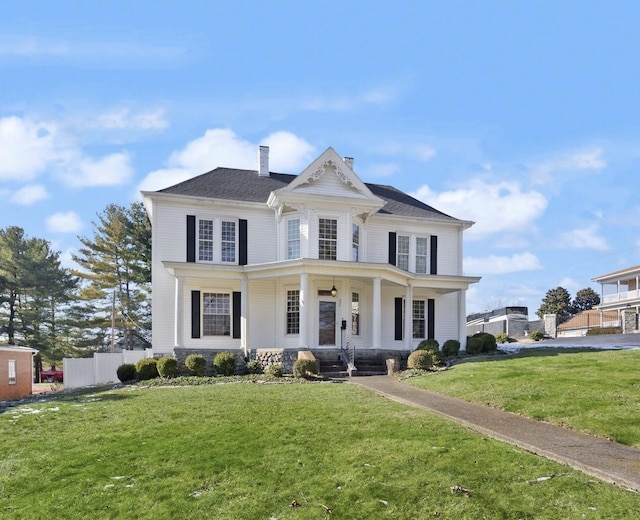 view of front of home featuring a porch and a front yard