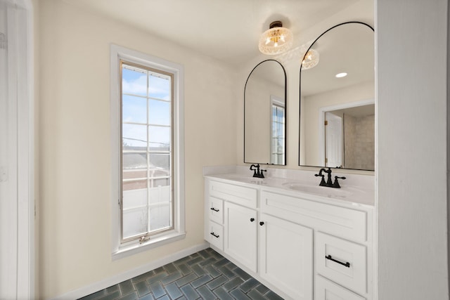 bathroom with tile patterned flooring and vanity