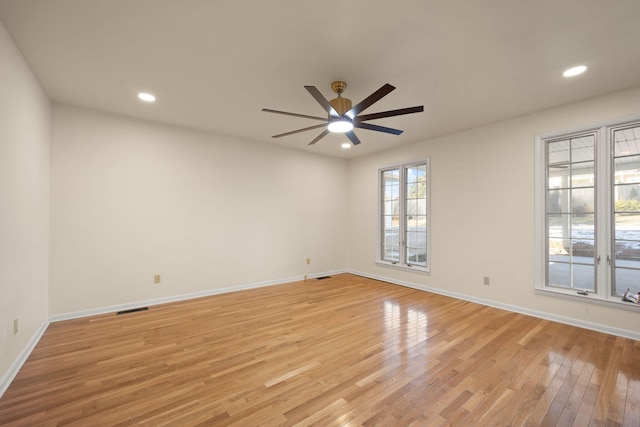 unfurnished room featuring light hardwood / wood-style flooring and ceiling fan