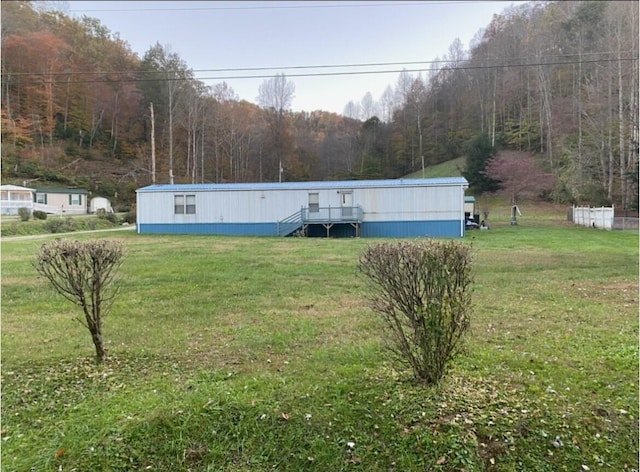 view of front of home with a front yard