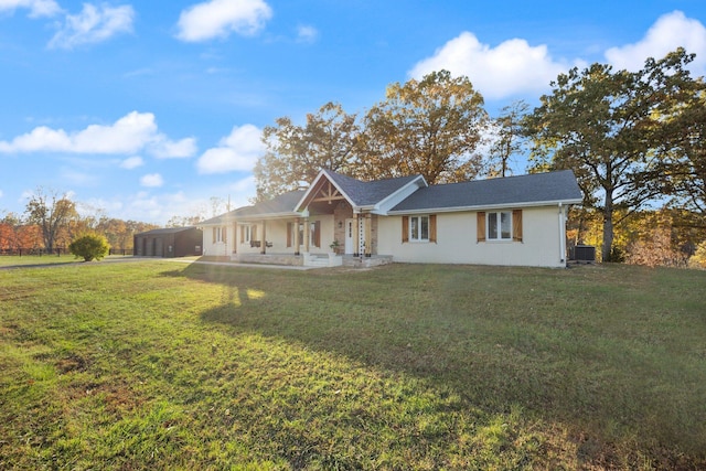 single story home with central AC, a front lawn, and a carport