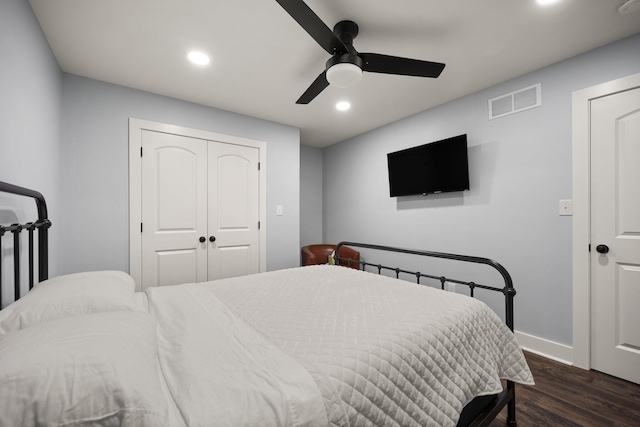 bedroom with ceiling fan and dark wood-type flooring