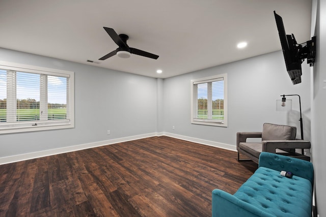 unfurnished room with ceiling fan and dark wood-type flooring