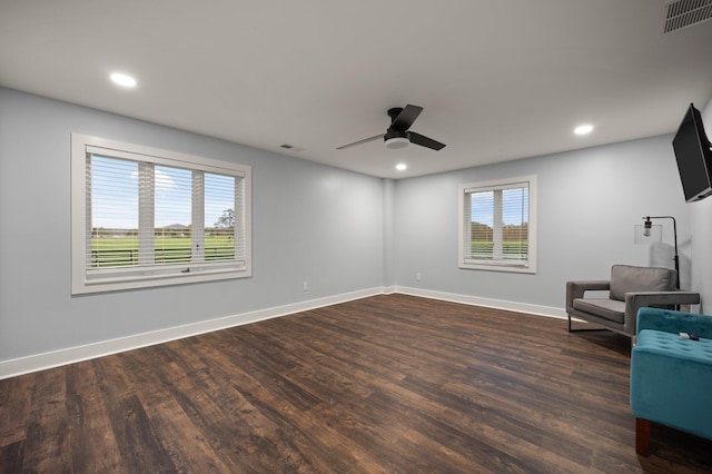 unfurnished room featuring ceiling fan and dark hardwood / wood-style floors