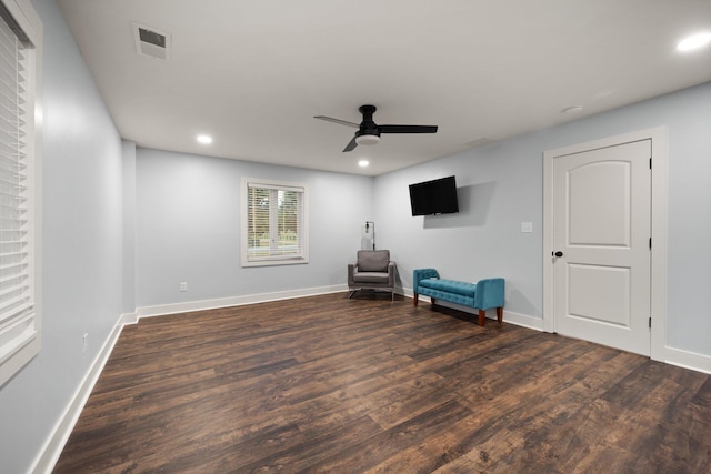 unfurnished room with ceiling fan and dark hardwood / wood-style floors