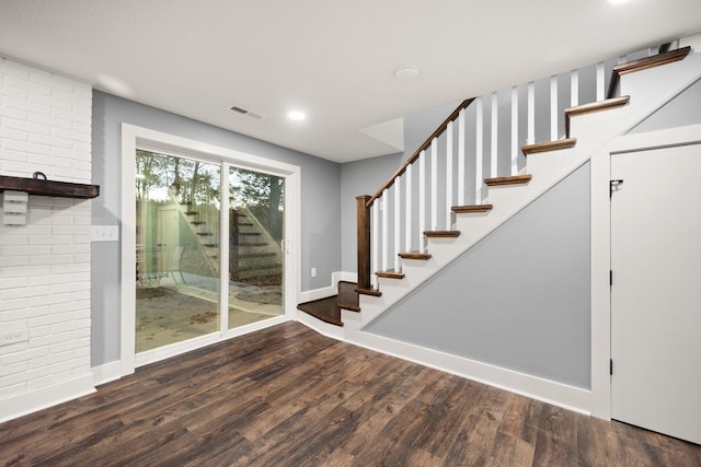 stairs with hardwood / wood-style floors