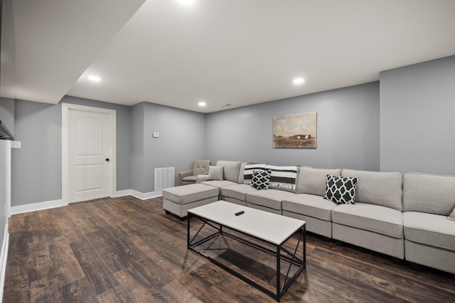 living room with dark hardwood / wood-style flooring