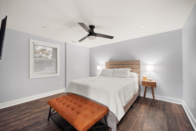 bedroom with ceiling fan and dark hardwood / wood-style floors