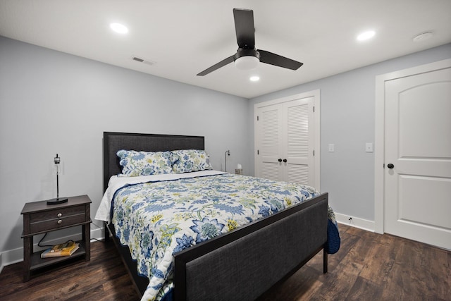 bedroom featuring ceiling fan, a closet, and dark hardwood / wood-style floors