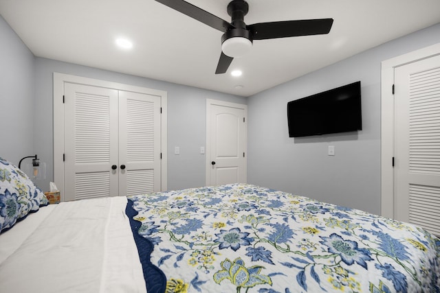 bedroom featuring ceiling fan and two closets