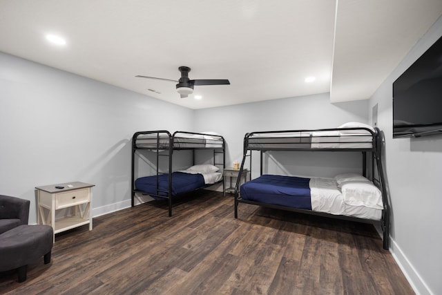 bedroom with ceiling fan and dark wood-type flooring