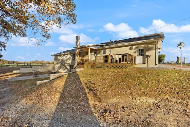 view of front of property with a deck