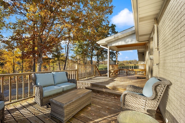 wooden deck featuring an outdoor hangout area