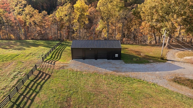 view of outbuilding featuring a lawn