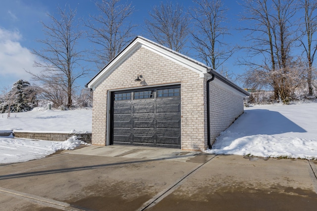 view of snow covered garage