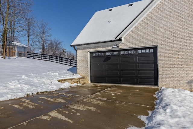 view of snow covered garage