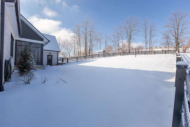 view of yard layered in snow