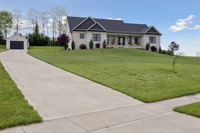 112 Tuscany Way, Richmond, KY 40475 - view of front of home with an outdoor structure, a garage, a front lawn, a porch, and brick siding