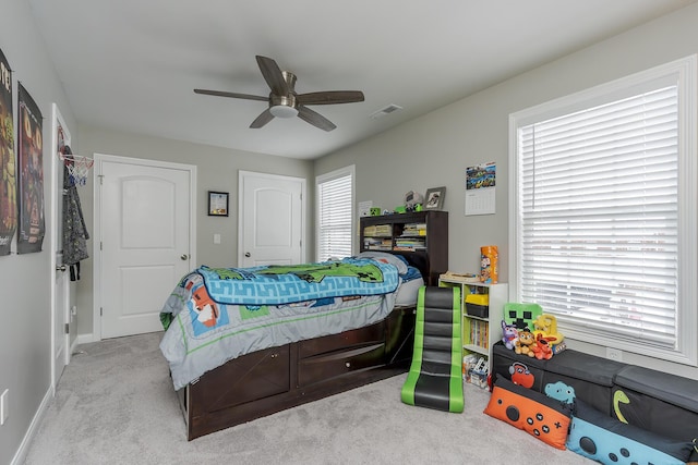 carpeted bedroom featuring ceiling fan