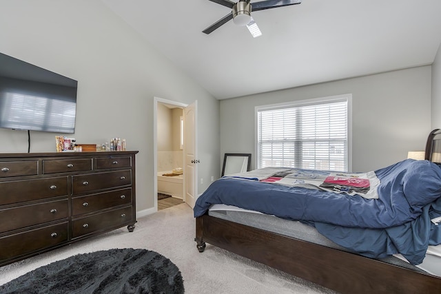 carpeted bedroom featuring lofted ceiling, ceiling fan, and ensuite bathroom