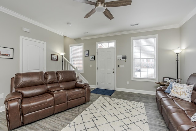 living room featuring crown molding, hardwood / wood-style floors, and ceiling fan