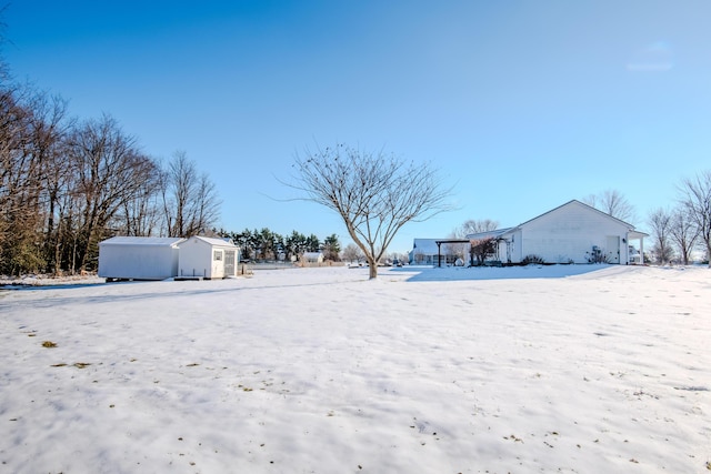 view of yard covered in snow