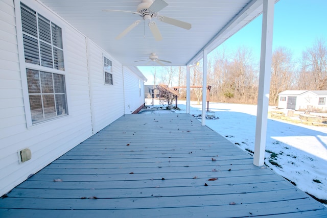 snow covered deck featuring ceiling fan