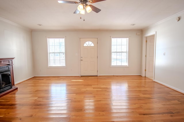 entrance foyer with light hardwood / wood-style floors, crown molding, and ceiling fan