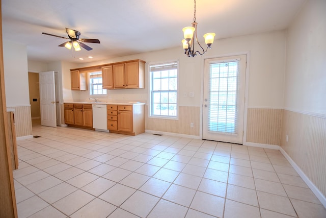 kitchen with pendant lighting, light tile patterned flooring, white dishwasher, light brown cabinets, and ceiling fan with notable chandelier