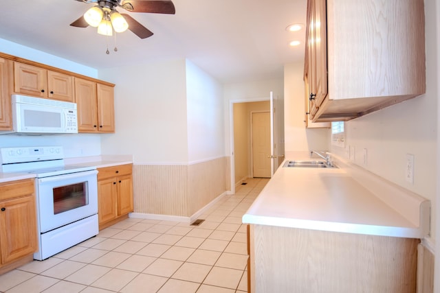 kitchen with ceiling fan, light brown cabinets, white appliances, light tile patterned flooring, and sink