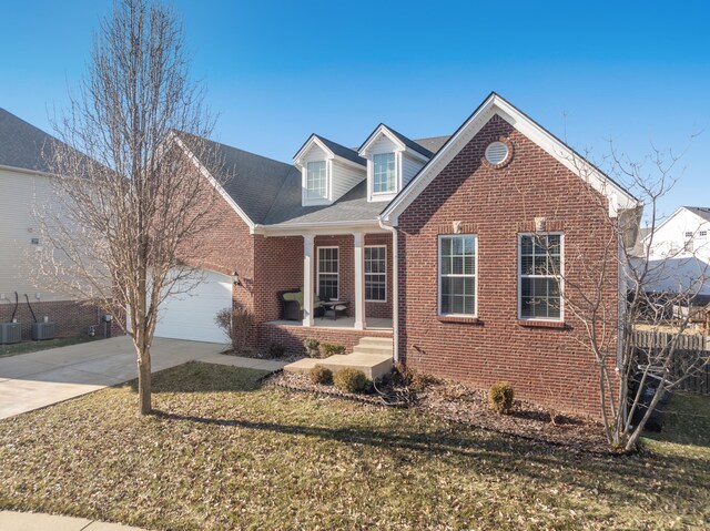 snow covered property entrance with covered porch