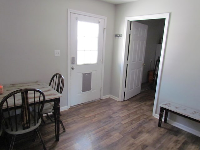 dining area featuring dark wood-type flooring