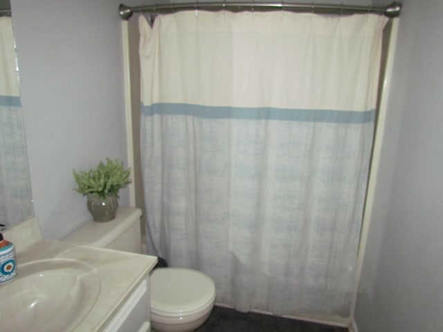 bathroom featuring vanity and toilet