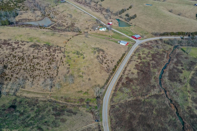 birds eye view of property featuring a rural view