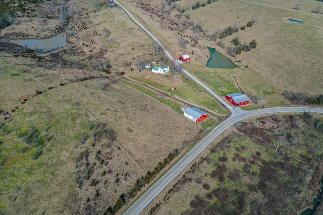 exterior space with a water view and a rural view