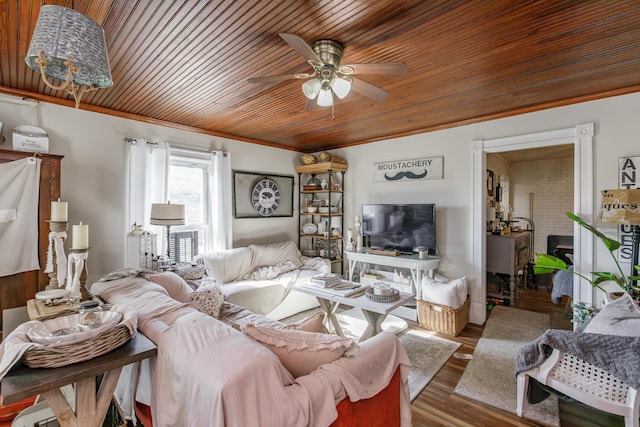 living room with wood ceiling, hardwood / wood-style flooring, ornamental molding, and ceiling fan