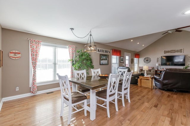 dining area with lofted ceiling, ceiling fan, and light hardwood / wood-style floors