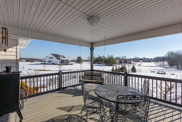 view of snow covered deck