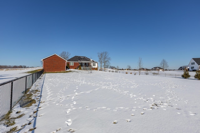 view of yard layered in snow