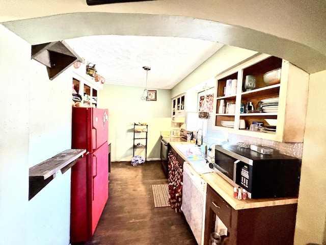 bar featuring white dishwasher and pendant lighting