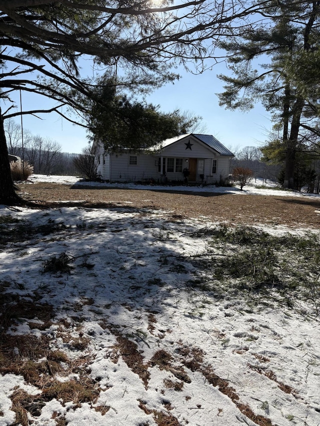 view of yard layered in snow