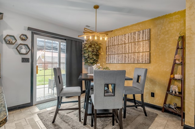 dining area featuring a chandelier