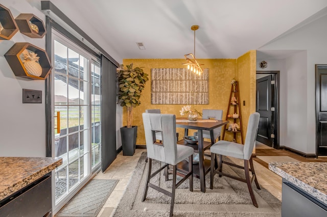 dining room with a notable chandelier