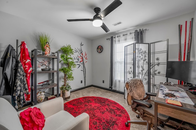 office space with ceiling fan and light colored carpet