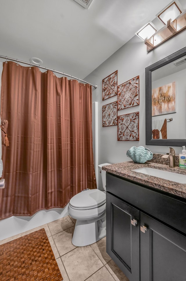 full bathroom with tile patterned flooring, vanity, toilet, and shower / bath combo with shower curtain