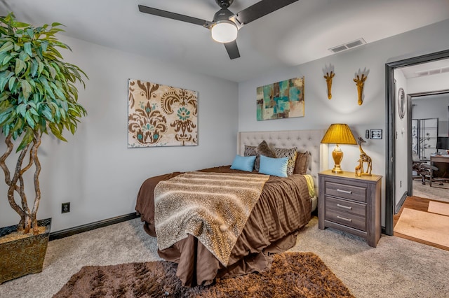 bedroom featuring ceiling fan and light colored carpet