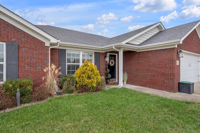 view of front of home featuring a garage and a front yard