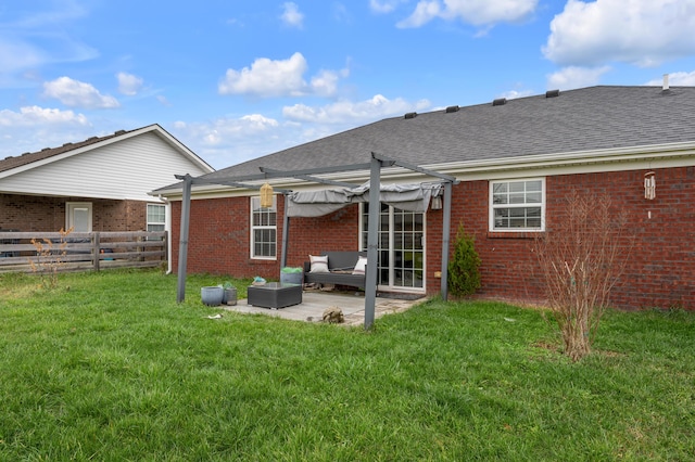 rear view of property with a lawn, a patio area, and outdoor lounge area