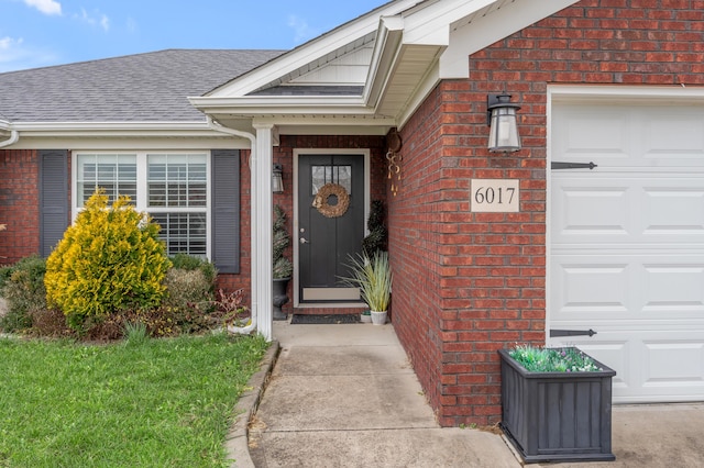 doorway to property featuring a garage